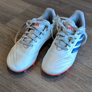 Adidas White and Blue Youth Soccer Cleats with Orange Accents